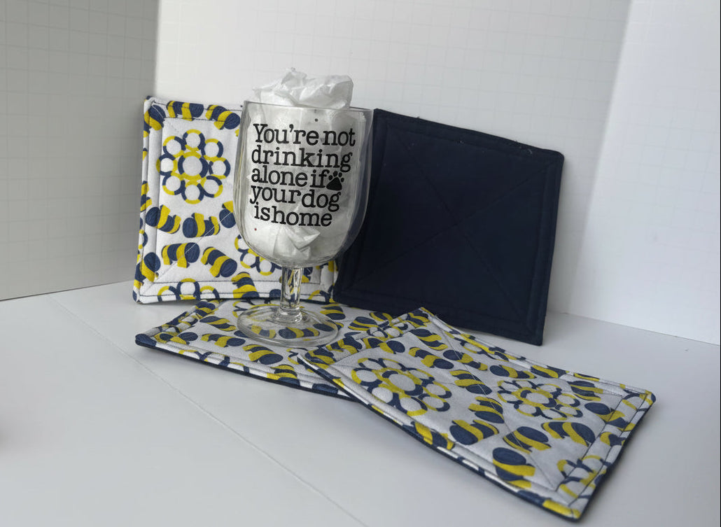 Quilted fabric coasters with agility tires and tunnels design.