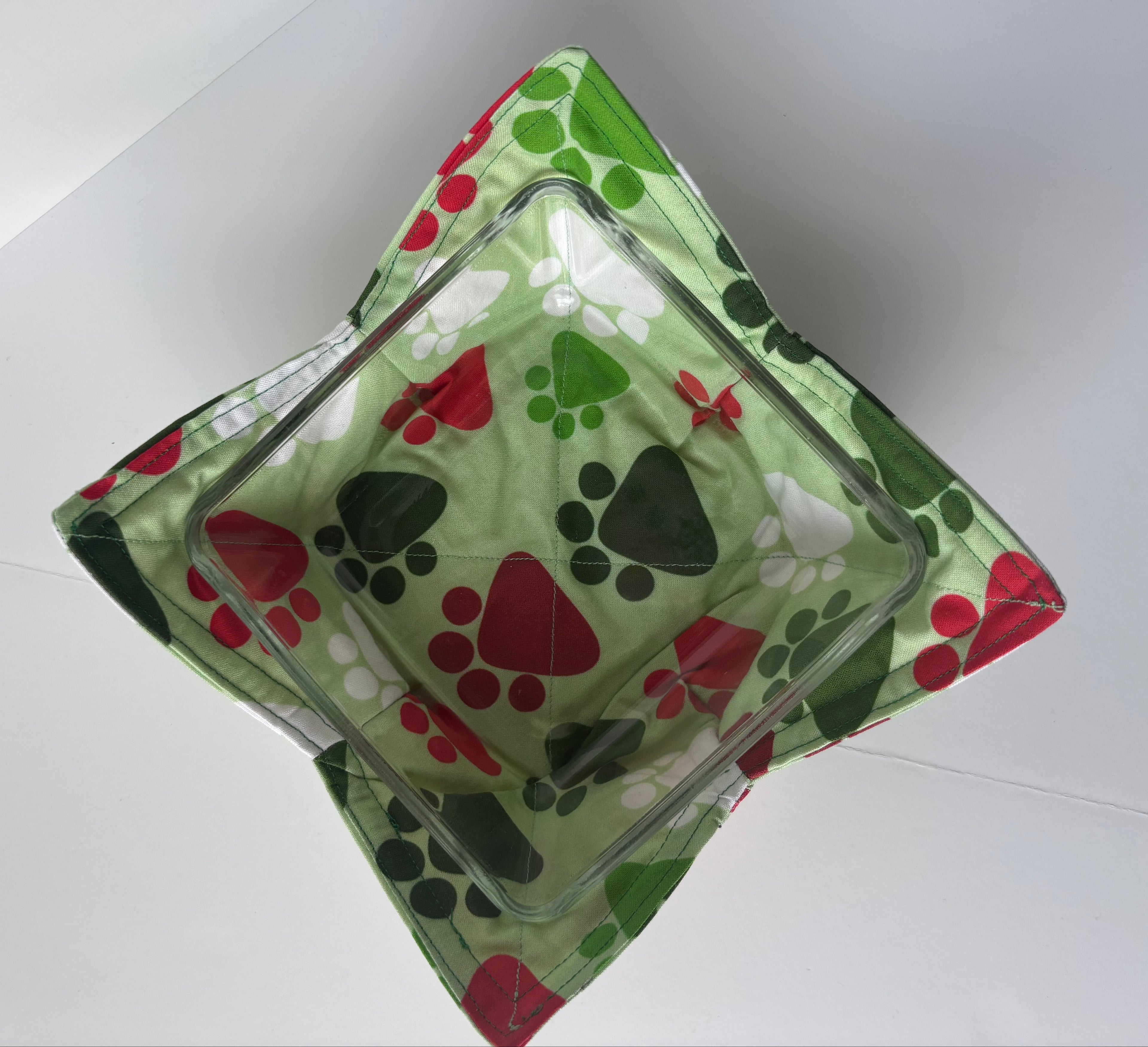 Green and red paw print cozy bowl with a glass dish