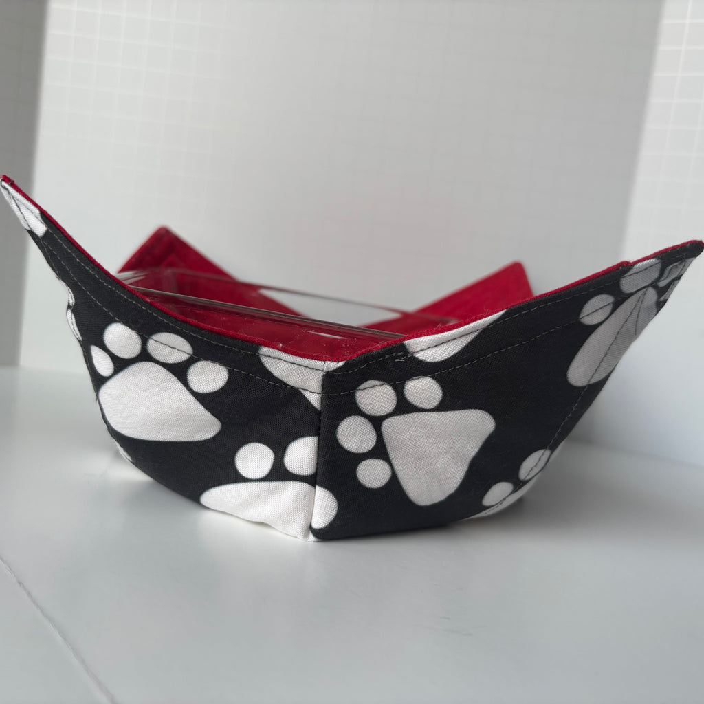 black and white paw print fabric and red on the inside