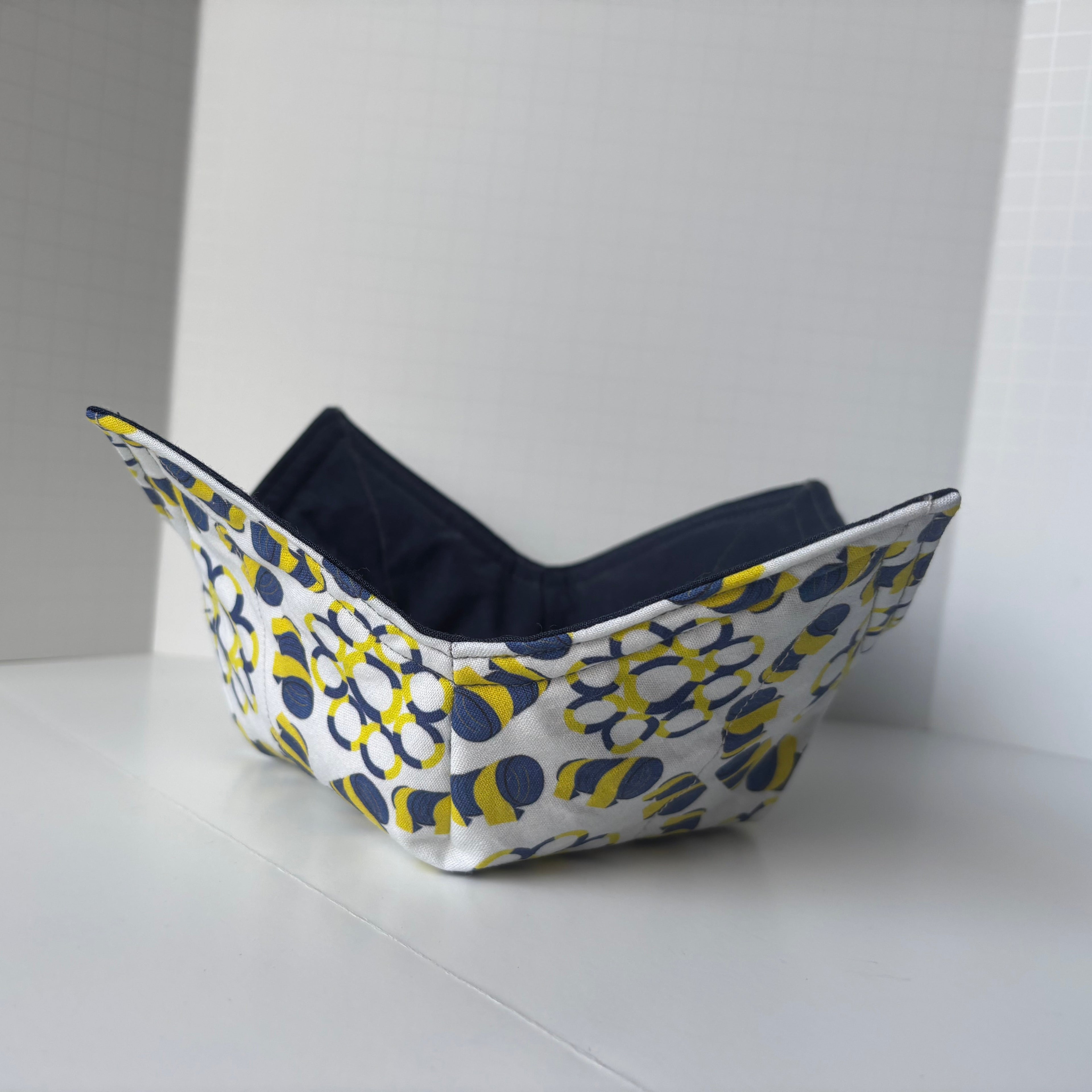 Fabric cozy bowl with agility tires and tunnel design on the outside. 