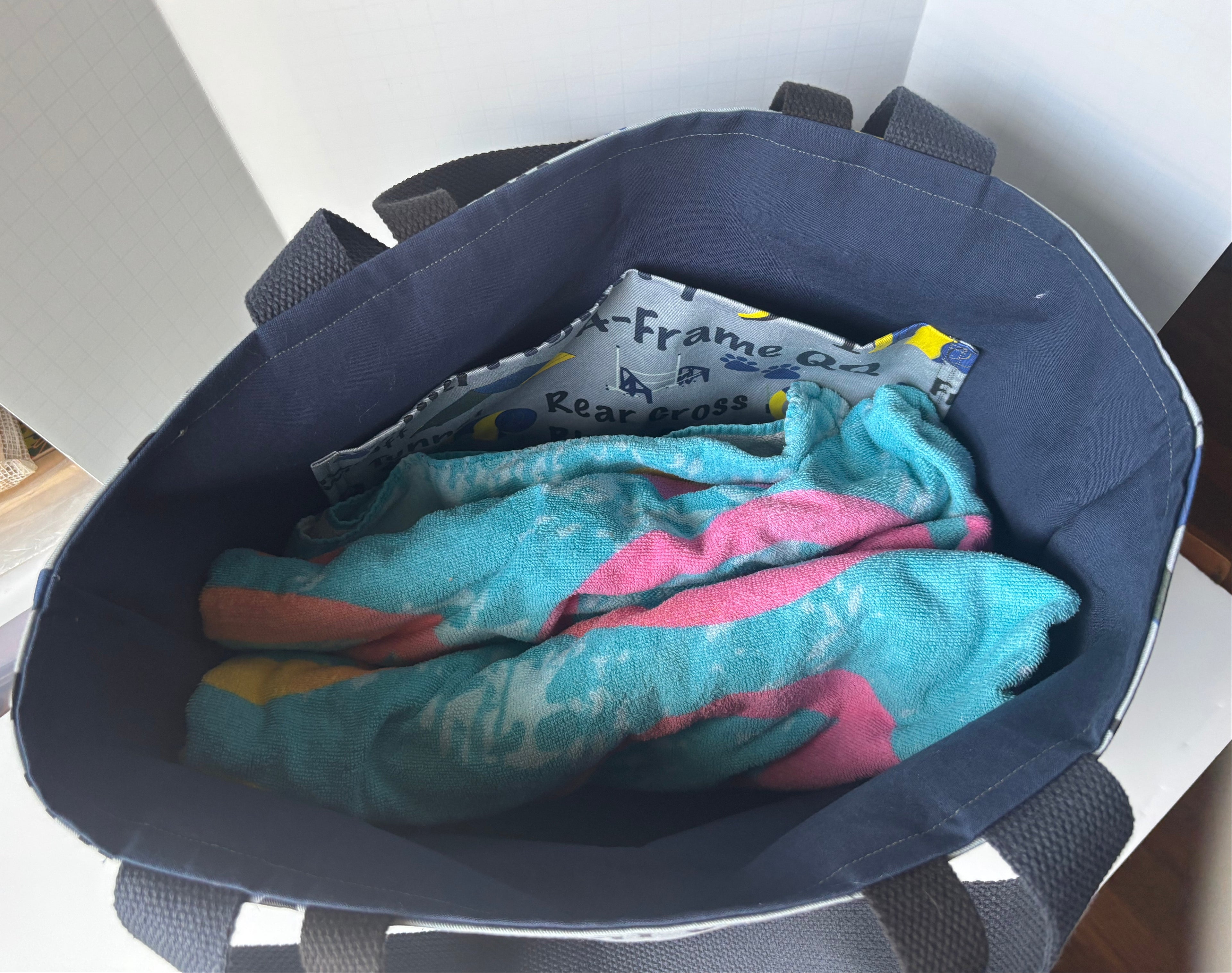 inside of tote bag holding a beach towel
