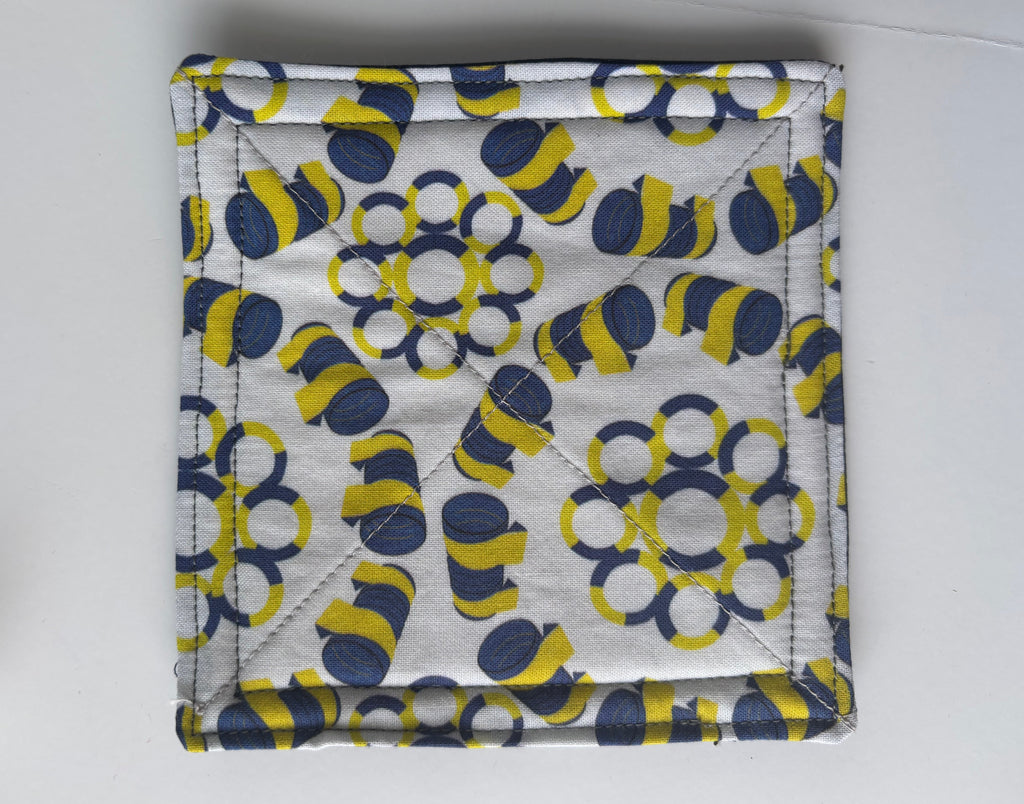 Quilted coaster with Agility tires and tunnels design